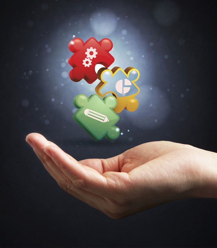 Colorful puzzle pieces with icons representing settings, data, and writing hover above an open hand against a dark