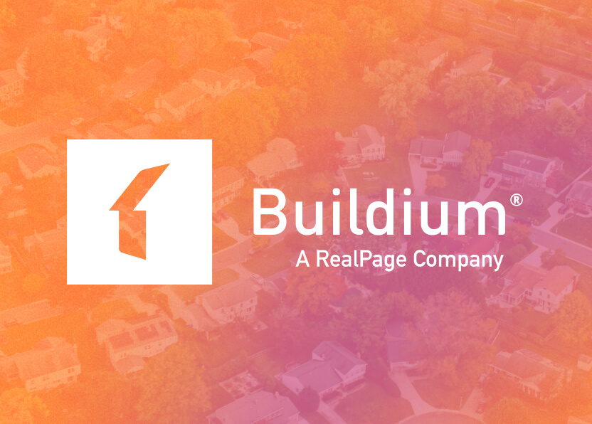 Buildium logo with a stylized number one, overlaid on a blurred aerial view of a residential neighborhood with an